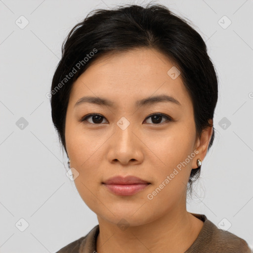 Joyful asian young-adult female with medium  black hair and brown eyes