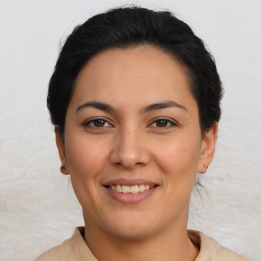 Joyful latino young-adult female with short  brown hair and brown eyes