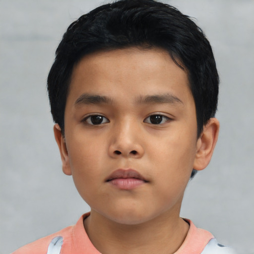 Neutral asian child male with short  brown hair and brown eyes