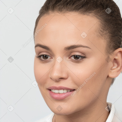 Joyful white young-adult female with short  brown hair and brown eyes