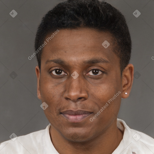 Joyful black young-adult male with short  brown hair and brown eyes