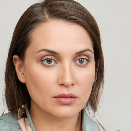 Neutral white young-adult female with medium  brown hair and grey eyes