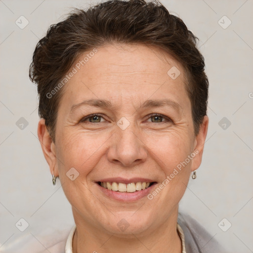 Joyful white adult female with short  brown hair and brown eyes