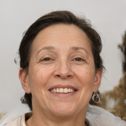 Joyful white middle-aged female with medium  brown hair and brown eyes