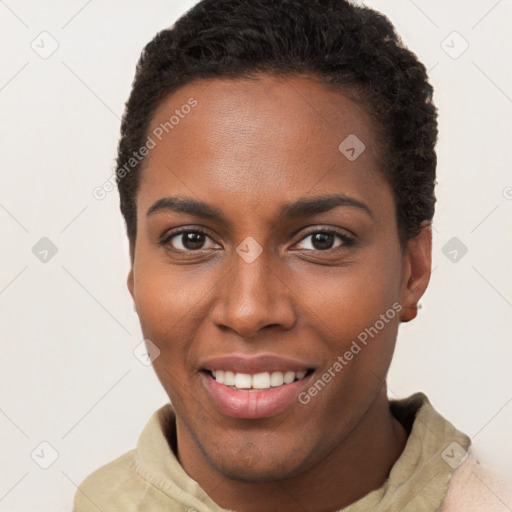 Joyful black young-adult female with short  brown hair and brown eyes