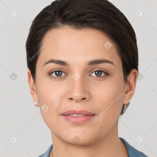 Joyful white young-adult female with short  brown hair and brown eyes