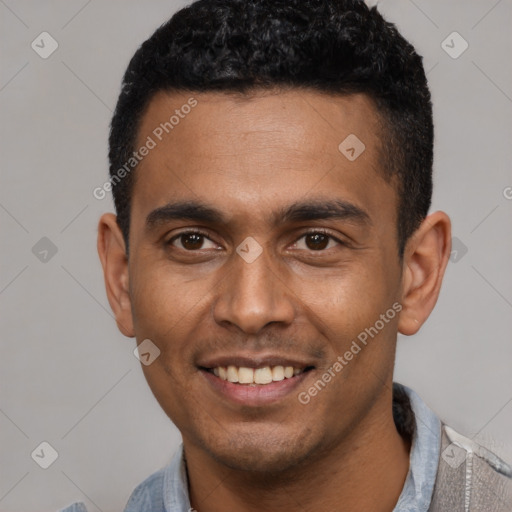 Joyful latino young-adult male with short  black hair and brown eyes