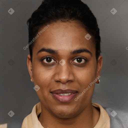 Joyful black young-adult female with short  brown hair and brown eyes