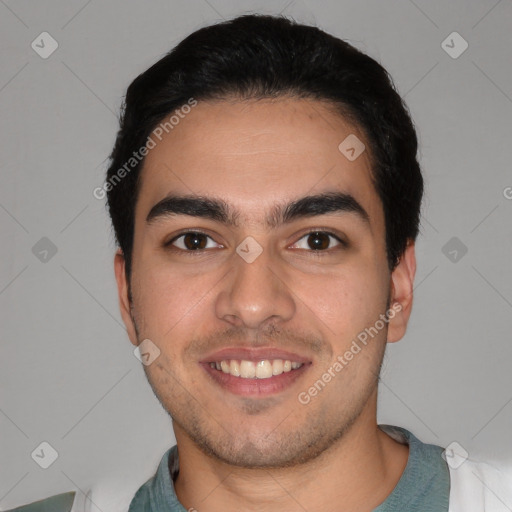 Joyful white young-adult male with short  black hair and brown eyes