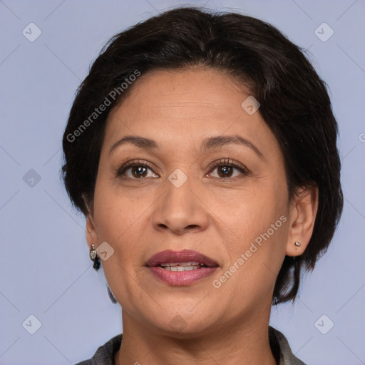 Joyful white adult female with medium  brown hair and brown eyes