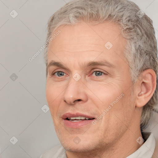 Joyful white adult male with short  brown hair and grey eyes