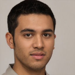 Neutral latino young-adult male with short  brown hair and brown eyes