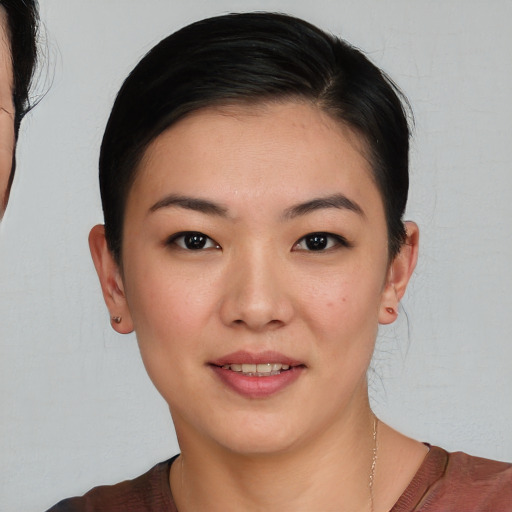 Joyful white young-adult female with short  brown hair and brown eyes