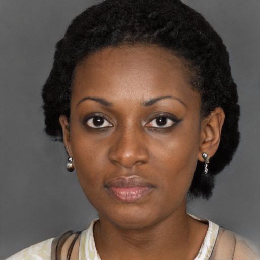 Neutral black young-adult female with medium  black hair and brown eyes