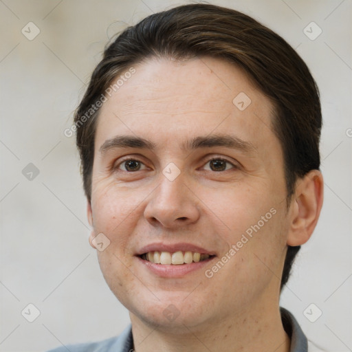 Joyful white adult male with short  brown hair and brown eyes