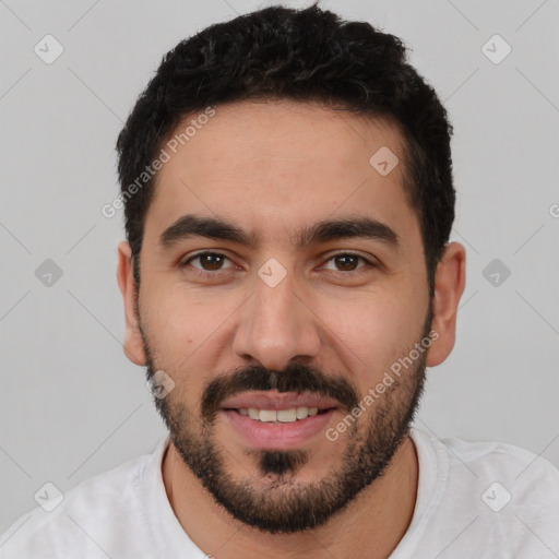 Joyful white young-adult male with short  black hair and brown eyes