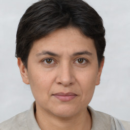 Joyful white adult female with short  brown hair and brown eyes