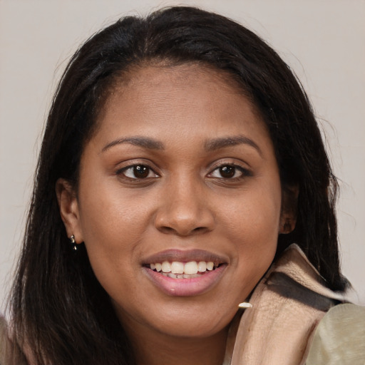 Joyful latino young-adult female with long  brown hair and brown eyes