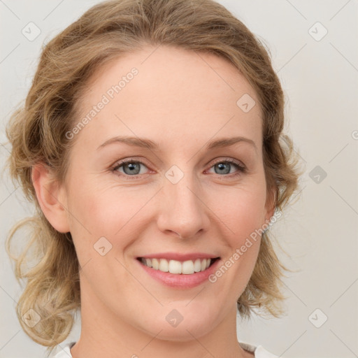 Joyful white young-adult female with medium  brown hair and blue eyes