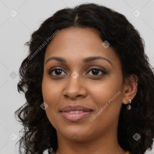 Joyful black young-adult female with long  brown hair and brown eyes