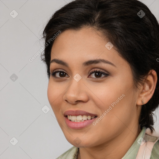 Joyful latino young-adult female with medium  brown hair and brown eyes