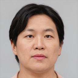 Neutral asian adult male with short  brown hair and brown eyes