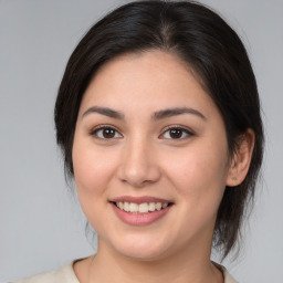 Joyful white young-adult female with medium  brown hair and brown eyes