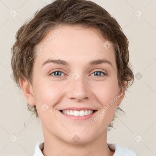 Joyful white young-adult female with medium  brown hair and green eyes