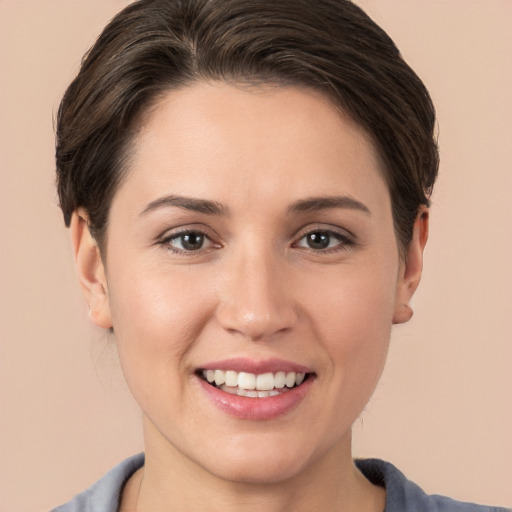 Joyful white young-adult female with medium  brown hair and brown eyes