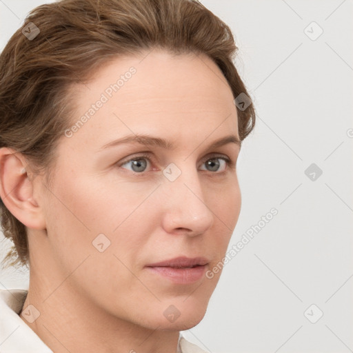 Neutral white young-adult female with short  brown hair and grey eyes