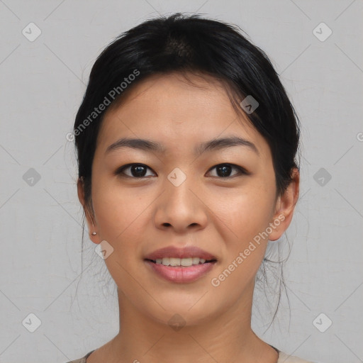 Joyful asian young-adult female with medium  black hair and brown eyes