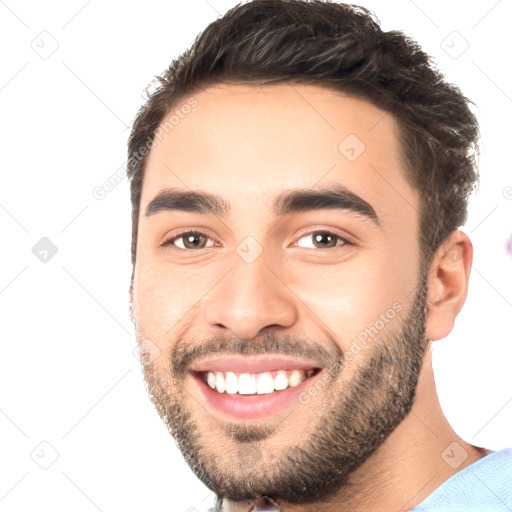 Joyful white young-adult male with short  black hair and brown eyes