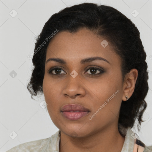 Joyful black young-adult female with medium  black hair and brown eyes