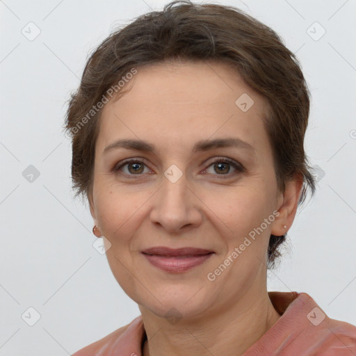 Joyful white adult female with short  brown hair and brown eyes