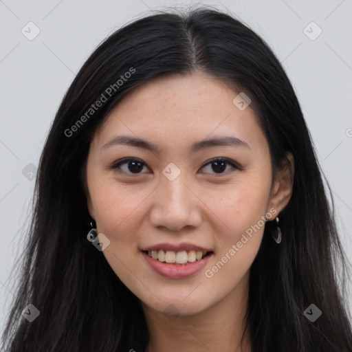 Joyful asian young-adult female with long  brown hair and brown eyes