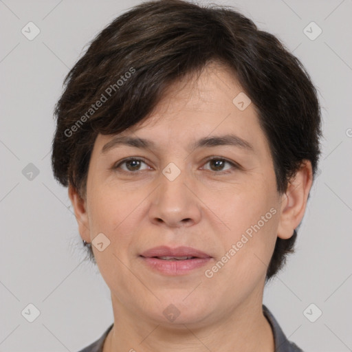 Joyful white adult female with short  brown hair and brown eyes