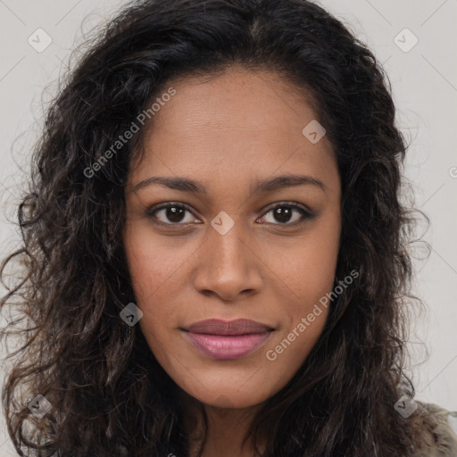 Joyful black young-adult female with long  brown hair and brown eyes