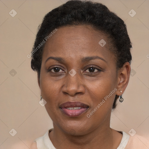 Joyful black adult female with short  brown hair and brown eyes