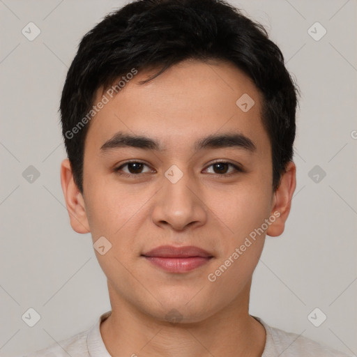 Joyful asian young-adult male with short  black hair and brown eyes