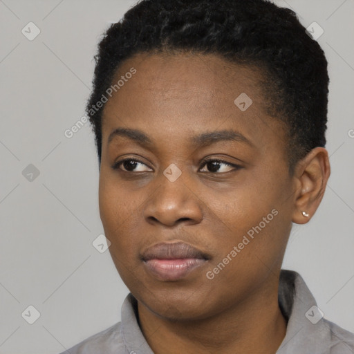 Joyful black young-adult female with short  black hair and brown eyes