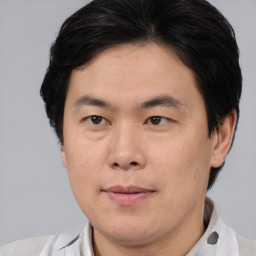 Neutral asian young-adult male with short  brown hair and brown eyes