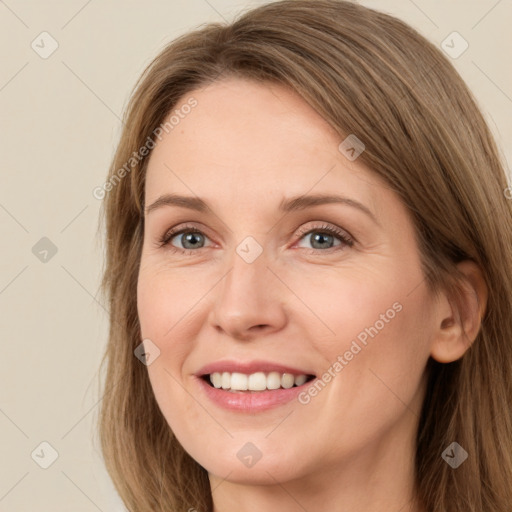 Joyful white young-adult female with long  brown hair and green eyes