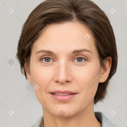 Joyful white adult female with medium  brown hair and grey eyes