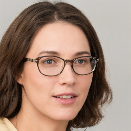 Neutral white young-adult female with medium  brown hair and green eyes