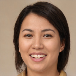 Joyful white young-adult female with medium  brown hair and brown eyes