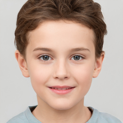 Joyful white child female with short  brown hair and grey eyes