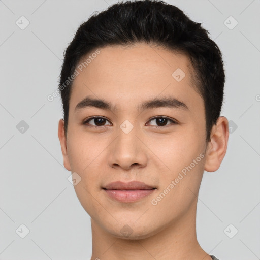 Joyful asian young-adult male with short  brown hair and brown eyes