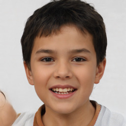 Joyful white child male with short  brown hair and brown eyes