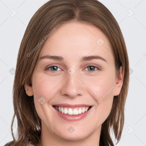 Joyful white young-adult female with long  brown hair and grey eyes