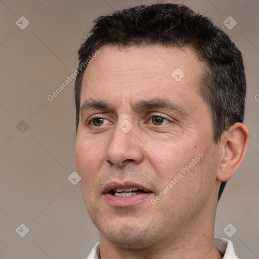 Joyful white adult male with short  brown hair and brown eyes